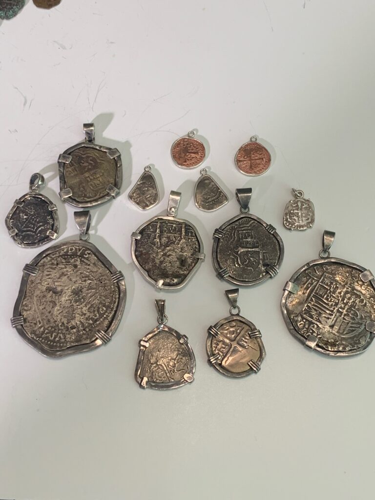 Necklace Mounted Gasparilla Coins available at Boggs Jewelers